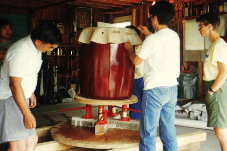 Members of Hinode Taiko in Canada place skin on taiko body
